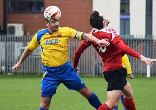 LEADING BY EXAMPLE -- captain and man-of-the-match Chris Timons (left) in action as AFC Mansfield grind out a precious victory at Knaresborough Town to maintain their promotion push.
