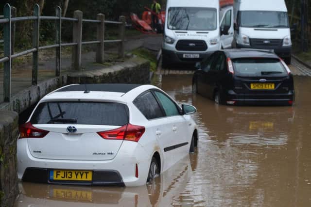 Two cars have been caught out in a ford at a notorious flooding spot in Rufford Lane.