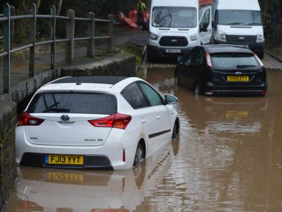 Two cars have been caught out in a ford at a notorious flooding spot in Rufford Lane.