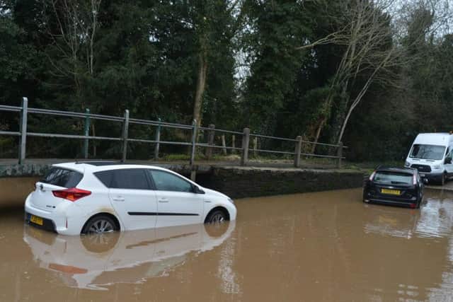 Both cars drove into the water as levels rose yesterday and had to be abandoned.