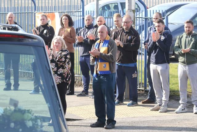 The funeral of Johnny Miller is applauded past Mansfield FC's ground
