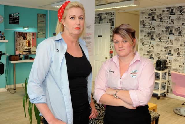 Mandy Clay, left, and Amy Elliott inside their hairdressers' shop, T Birds and Pink Ladies, on Forest Road, Annesley.