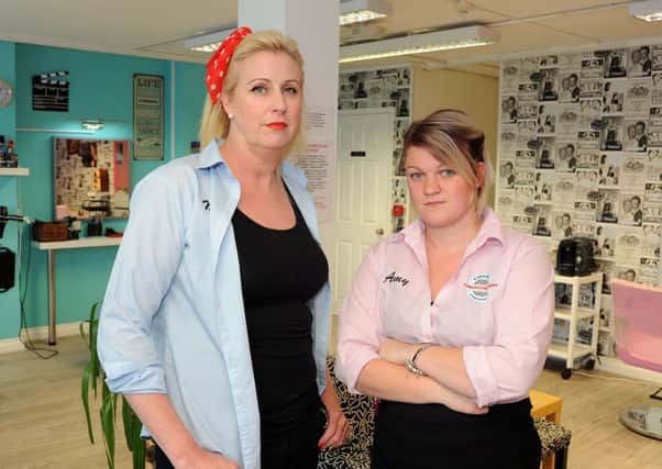 Mandy Clay, left, and Amy Elliott inside their hairdressers' shop, T Birds and Pink Ladies, on Forest Road, Annesley.