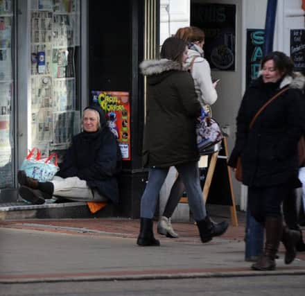 A homeless person in a shop front. Picture: Andrew Roe