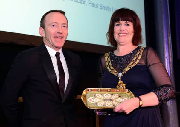 Ashley Long MD of Paul Smith receiving the award from Chamber President Jean Mountain.