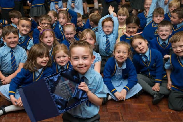 St Lukes CE Primary School , Lowton, Cheshire, was presented with its Epilepsy Action Edwards Award by Ian Walker, vice-chair of the Epilepsy Action council of management:  Aarron Prendergast, six, with the Epilepsy Action Edwards Award