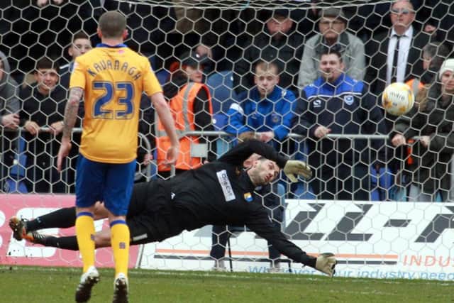 Mansfield Town v Portsmouth on Saturday March 19th 2016. Mansfield keeper Scott Shearer saves a penalty. Photo: Chris Etchells