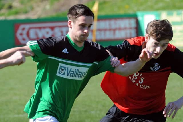 VICKERS IN A TWIST -- Sam Vickers (left), who was on the scoresheet again in Belper United's victory.