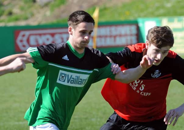 VICKERS IN A TWIST -- Sam Vickers (left), who was on the scoresheet again in Belper United's victory.