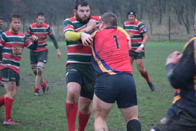 LEADING FROM THE FRONT -- captain Chris Houseman taking the fight to Lincoln with his trademark running.