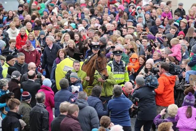 A HERO'S RETURN -- Crabbie's Grand National winner Rule The World is given a rousing reception as he returns to Mullingar in Ireland, the home town of owner Michael O'Leary.