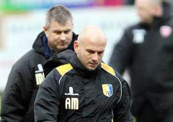 Mansfield Town manager Adam Murray with assistant Micky Moore behind.Picture by Dan Westwell