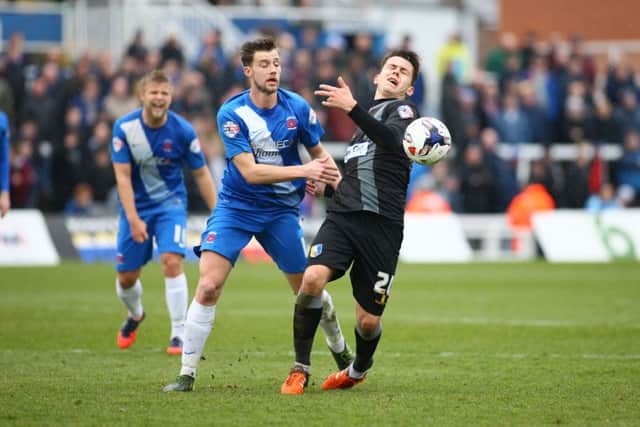 Mansfield Town's Jack Thomas is brought down - Pic Chris Holloway