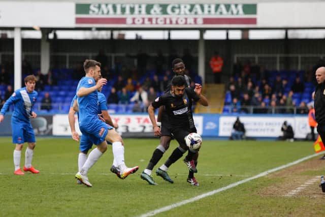 Mansfield Town's Mal Benning breaks through the Hartlepool defence - Pic Chris Holloway