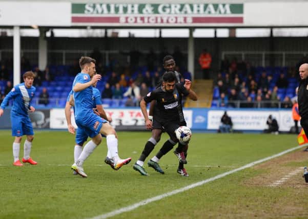 Mansfield Town's Mal Benning breaks through the Hartlepool defence - Pic Chris Holloway