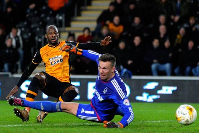 Sone Aluko scores the Tigers equaliser past Dorus De Vries.Hull City v Nottingham Forest.  KC Stadium.  SkyBet Championship.  15 March 2016.  Picture Bruce Rollinson