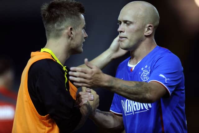 Sheffield Wednesday v Glasgow Rangers......Owls ex Ranger Rhys McCabe at the final whistle with Nicky Law