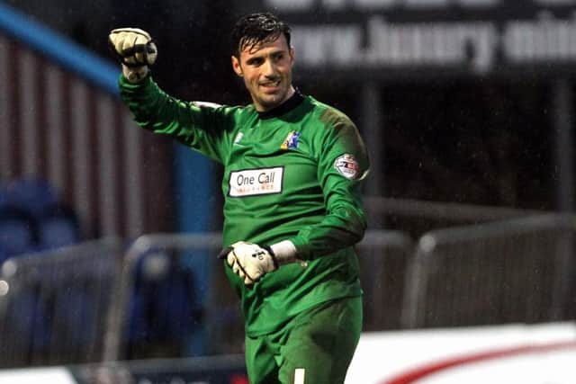 Mansfield Town v Morecambe English League Football - Sky BET League Two One Call Stadium, Mansfield, England. 6th February 2016  Mansfield Town goalkeeper Scott Shearer celebrates the full time whistle after saving two penalties in the 2-1 win.
