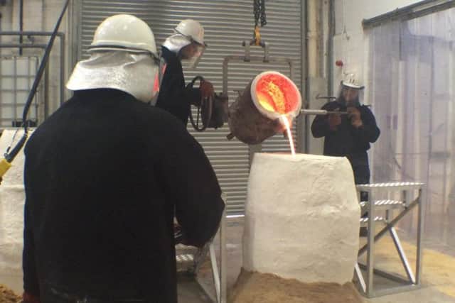 Women Of Steel statue being cast in bronze at Pangolin Editions foundry,near Stroud in Gloucestershire.