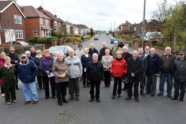 Residents from Searby Road, Sutton, who are opposed to housing plans near their homes, get the support of Councillor Steve Carroll, sixth from right.