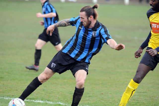 Selston defender Perry Marriott is put under pressure against Hucknall Town last Saturday. Marriott and his teammates will be in action again this weekend during Chairman's Day.