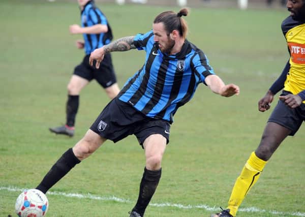 Selston defender Perry Marriott is put under pressure against Hucknall Town last Saturday. Marriott and his teammates will be in action again this weekend during Chairman's Day.
