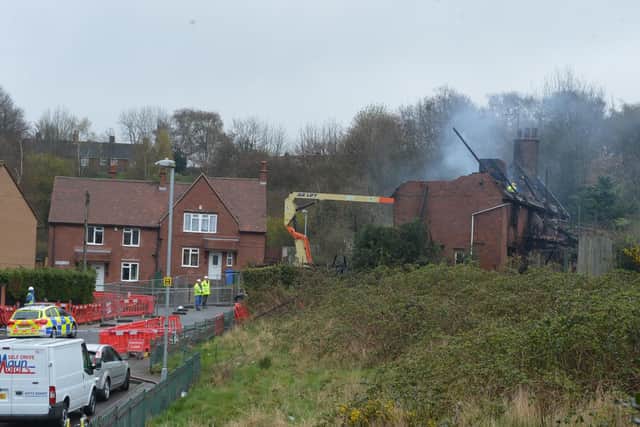 Nottinghamshire Fire & Rescue works alongside Environmental Services Contractors workers to clear the site.