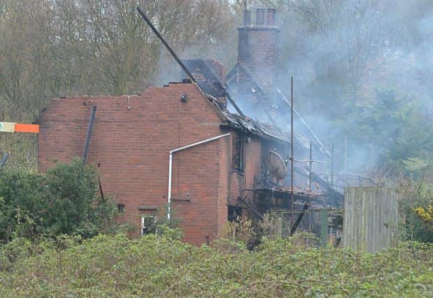 Parts of the roof and upper floor are removed to allow firefighters to search the ground floor.