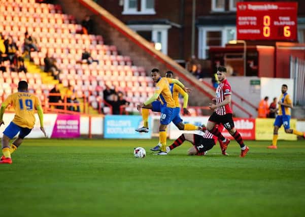 Mansfield Town's Matt Green looks to make the pass - Picture Chris Holloway