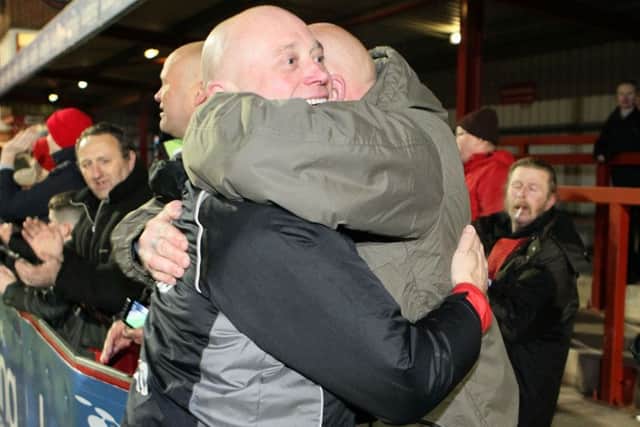 Fans hug manager Nicky Law after winning the Derbyshire FA Senior Cup  - Pic by: Richard Parkes