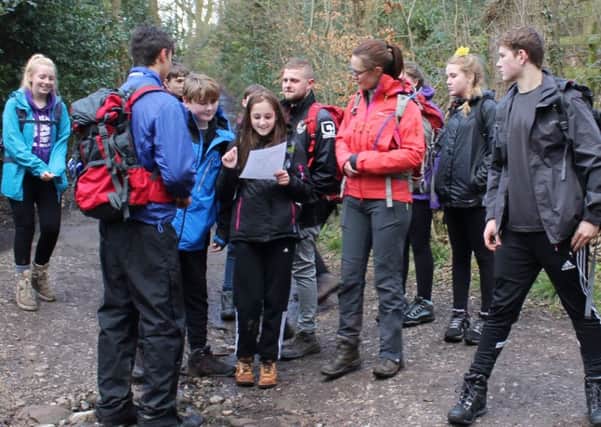 Shirebrook Academy pupil Alex Sunderland, 15, gets her bearings during a map-reading exercise during a training weekend in readiness for a two-week adventure in Namibia this summer.