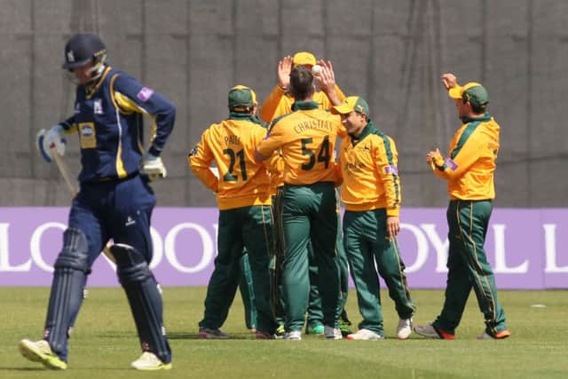 Dan Christian is congratulated by his team mates after getting the wicket of Warwickshire's Laurie Evans - Pic by: Richard Parkes