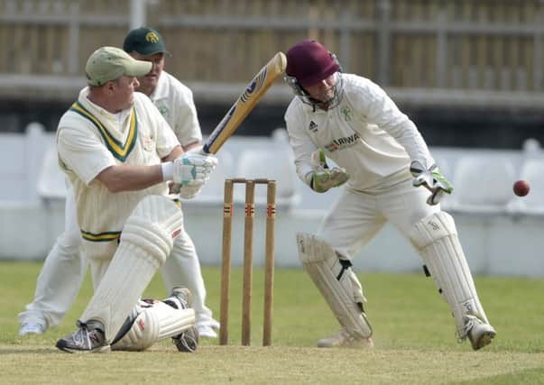 ON THE SWEEP -- Tim Smith, batting for Worksop under the watchful eye of Edwinstowe wicketkeeper Gary Wilson in The Championship of the Bassetlaw League.