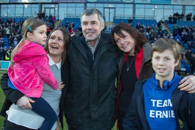 Chesterfield vs Port Vale - Ernie moss on the pitch with family members - Pic By James Williamson