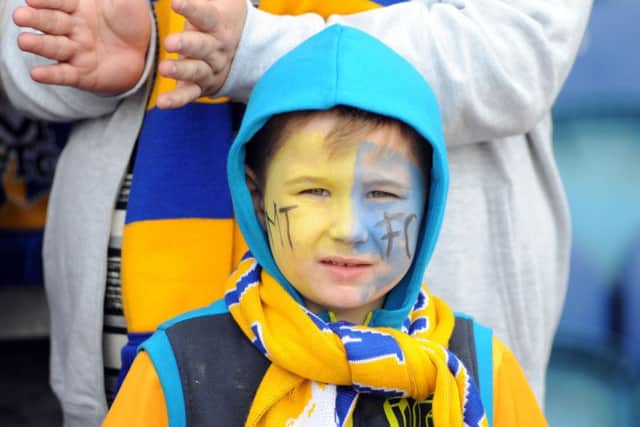 Mansfield Town v Cambridge Utd.Fans and players celebrate the last game of the season at the One Call Stadium.