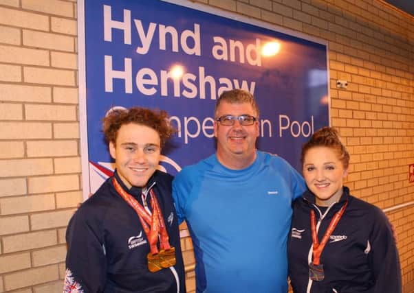 Glenn Smith, centre, with Ollie Hynd MBE and Charlotte Henshaw.