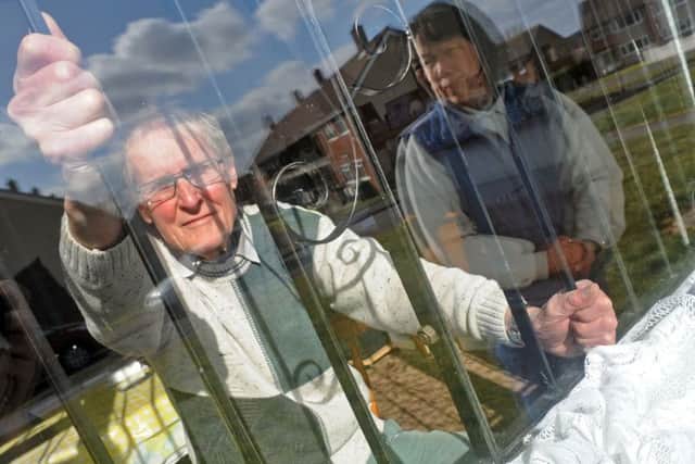 Dennis and Doris Buckley of Willow Crescent with the burglar bars that are on their Willow Crescent home.