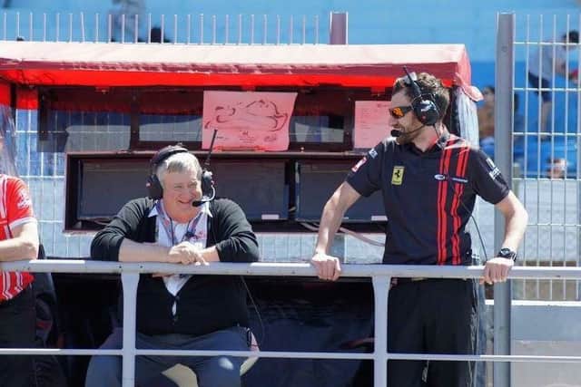 Chris Moore, right, enjoying the racing.