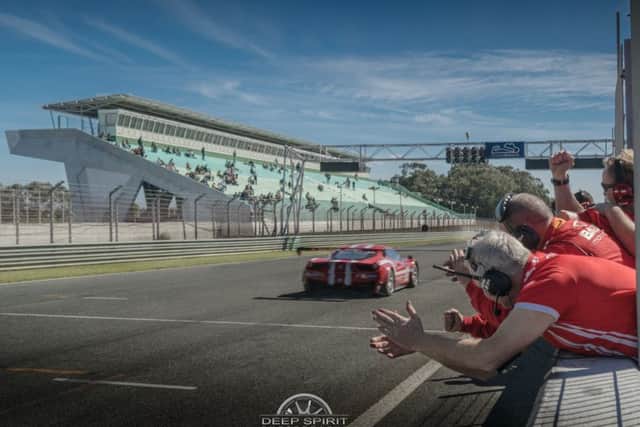Cheering the Balfe car on.
