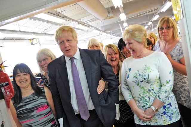 The former London mayor poses with employees of David Nieper, based in Alfreton.