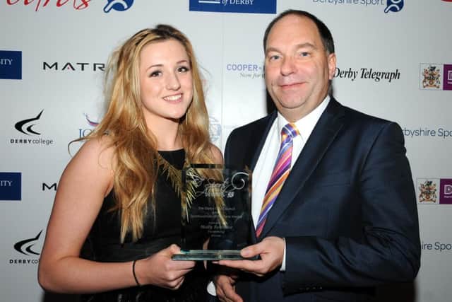 ON THE PLANE - Molly, pictured above receiving an award from Cllr Paul Bayliss, is through to the 100m breaststroke final of the European Championships with a third placed finish in a time of 1:07.82 - a new PB - in Tuesday evenings semi-final.