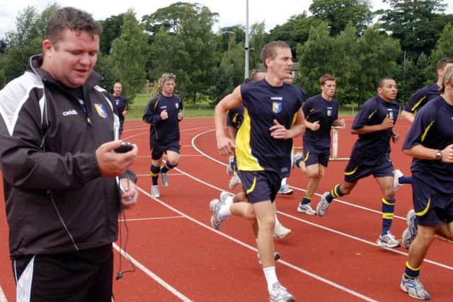 Paul Holland (left) with the Mansfield Town squad back in his days with the Stags.