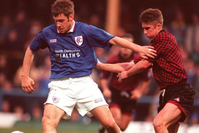 Chesterfield v Bury
Tony Lormor fends off the challenge of Burys David Pugh