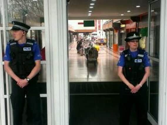 Officers cordoned off the Idlewells Shopping Centre in Sutton today.