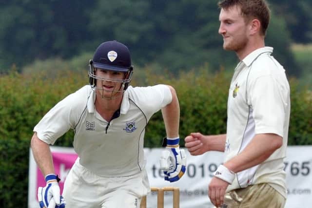 Hucknall v Kimberley.
Kimberley's James Neesham gets their total over the 300 watched by a rueful William Spray.