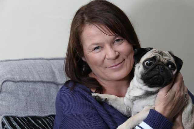 Kirkby mum Suzanne Crofts knelt down to stroke a dog only to be savagely attacked.