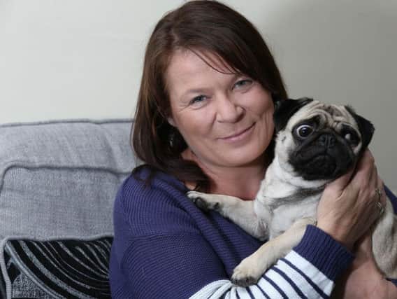 Kirkby mum Suzanne Crofts knelt down to stroke a dog only to be savagely attacked.