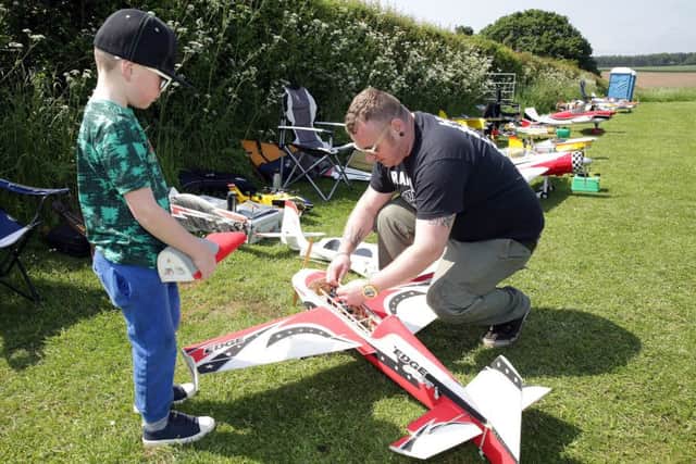 Father & son team Ethan and Nick Dawson get ready to fly. Photo by Glenn Ashley.