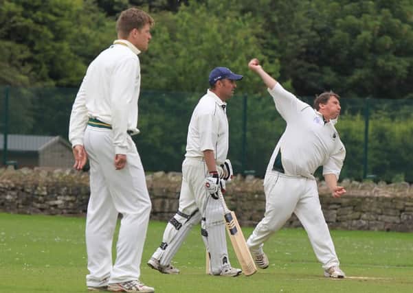 LOVELY BOWLING -- Farnsfield's Dave Loveridge on his way to a five-wicket haul in the victory over Whitwell.