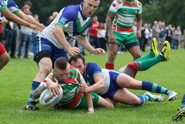Peter Alldread powers through to score a try for Wolfhunt  - Pic by: Richard Parkes